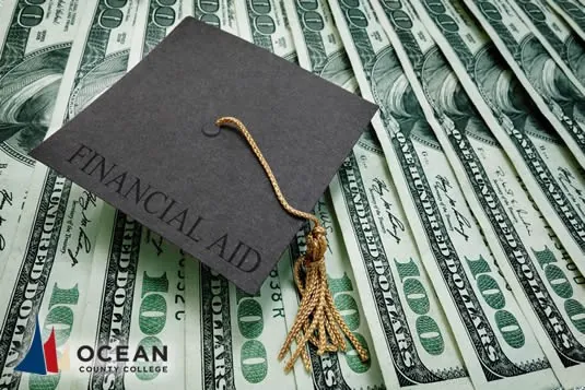 Graduation cap on top of money