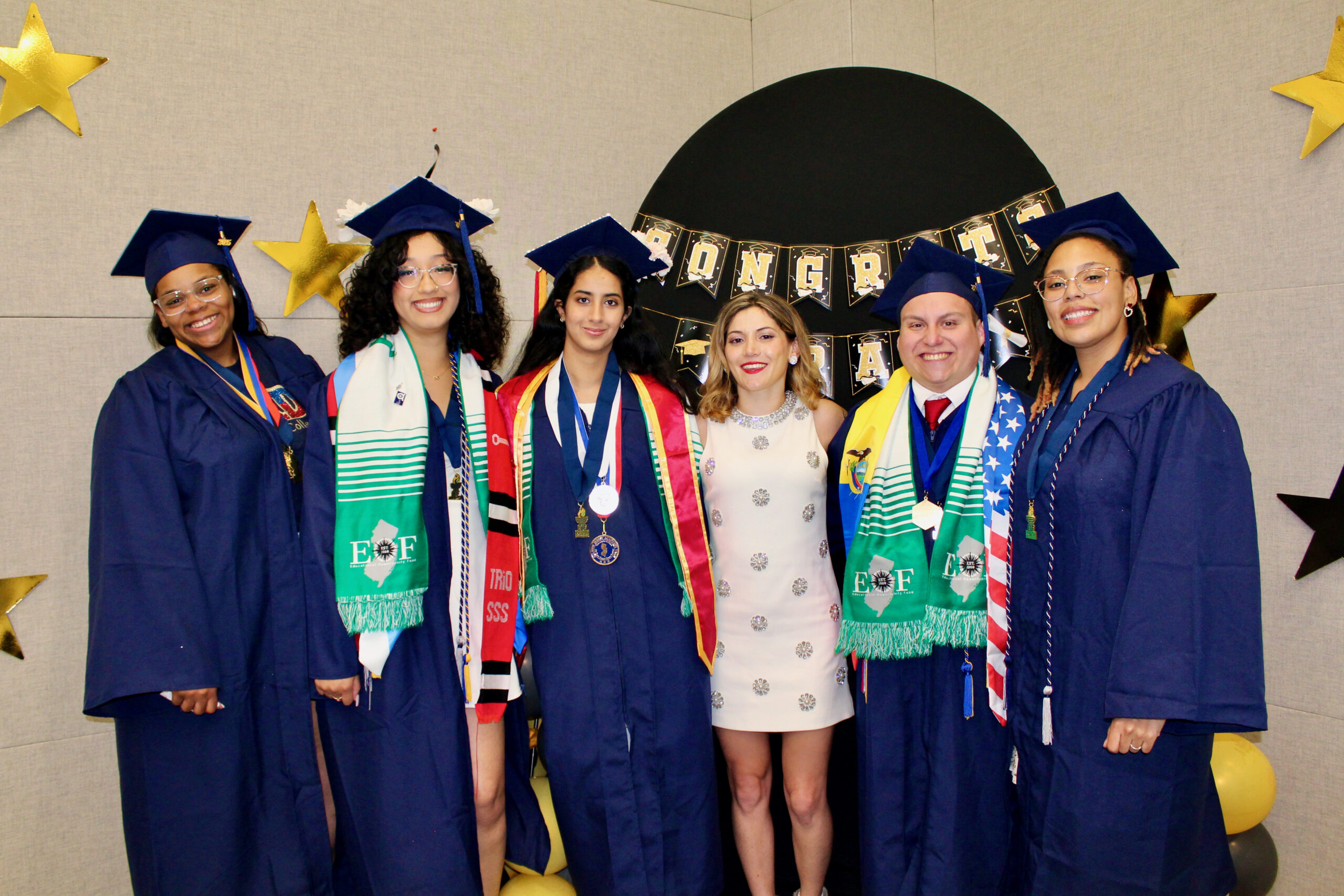 group of EOF students posing together in their cap and gowns