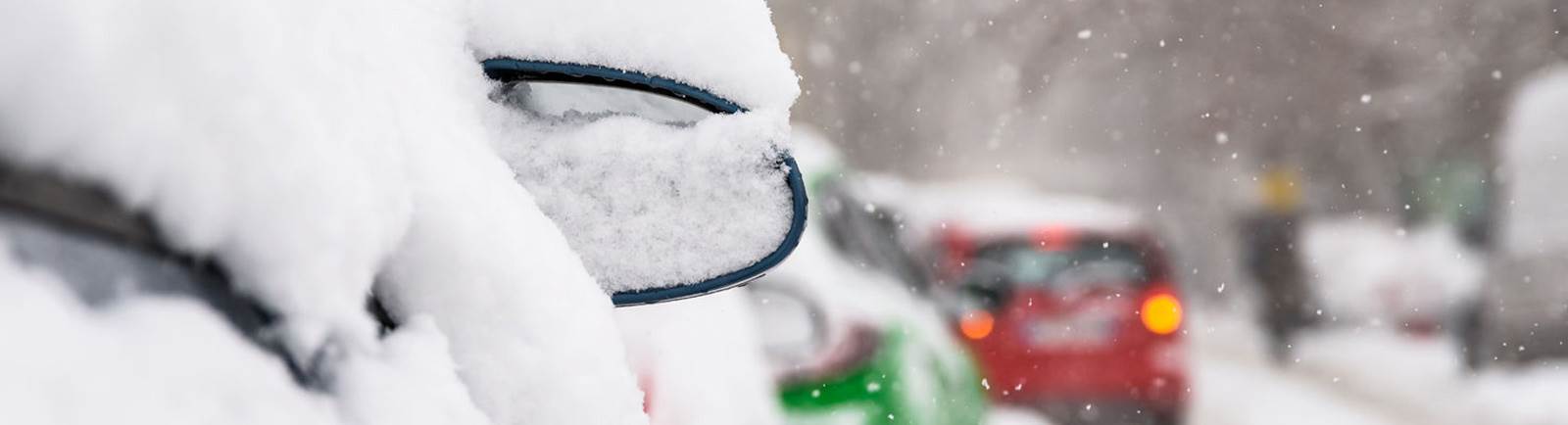 Close up of a car covered in snow