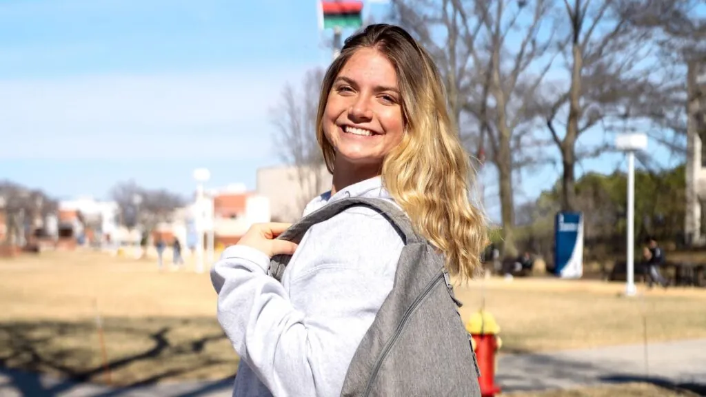 Viking influencer standing posing for picture on campus
