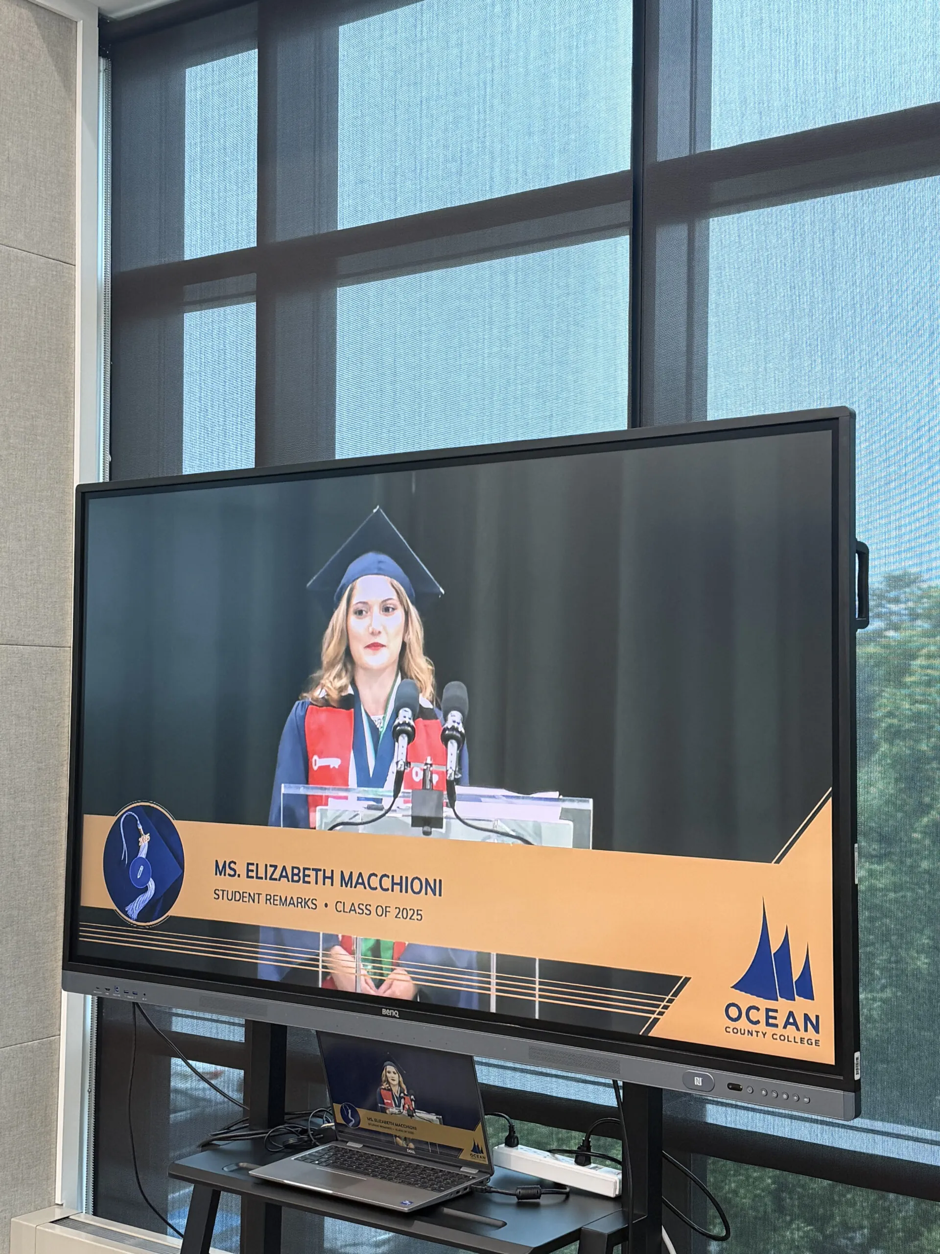 TV screen displaying OCC student commencement speaker