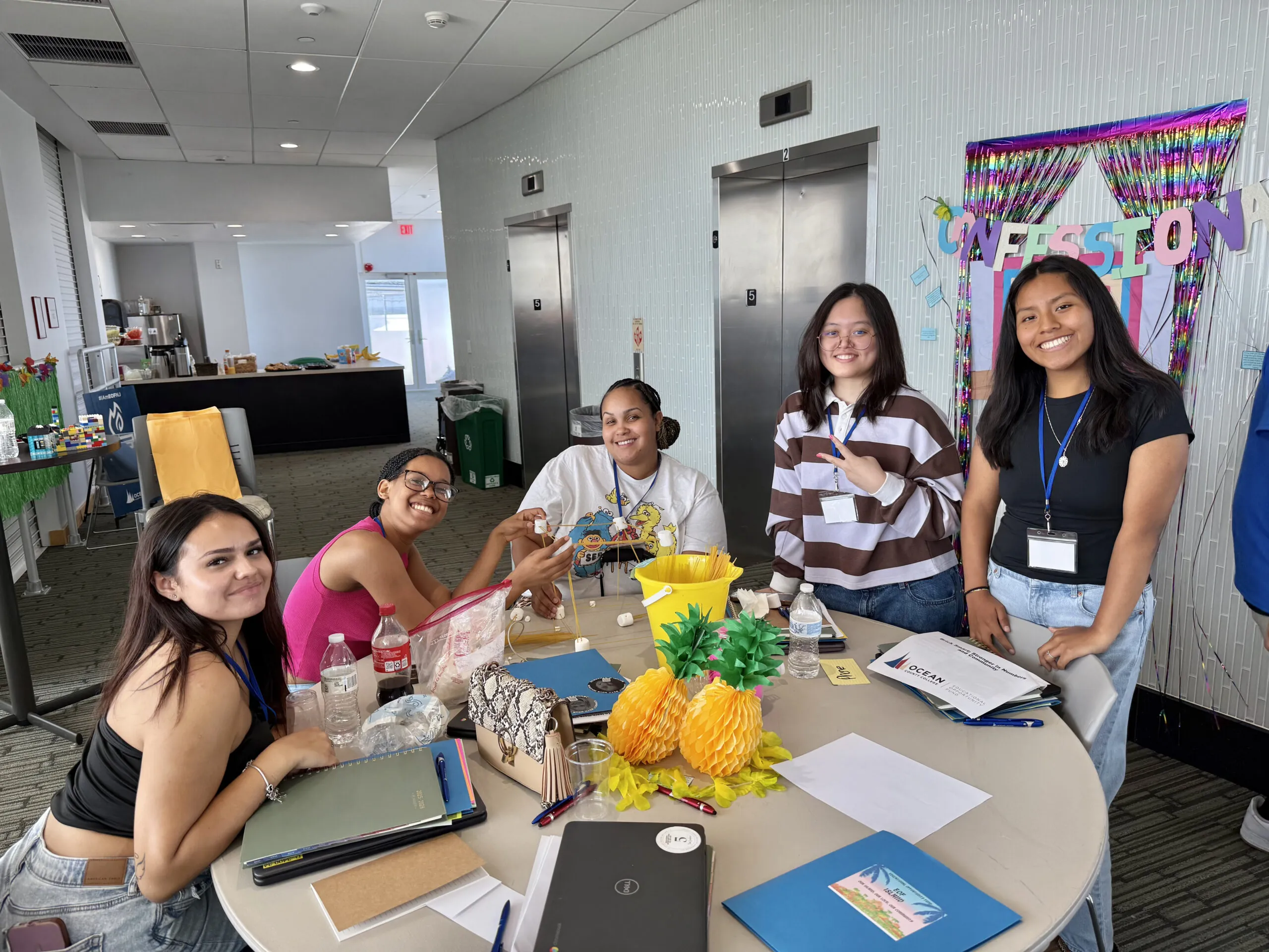 group of eof students sitting at a table 