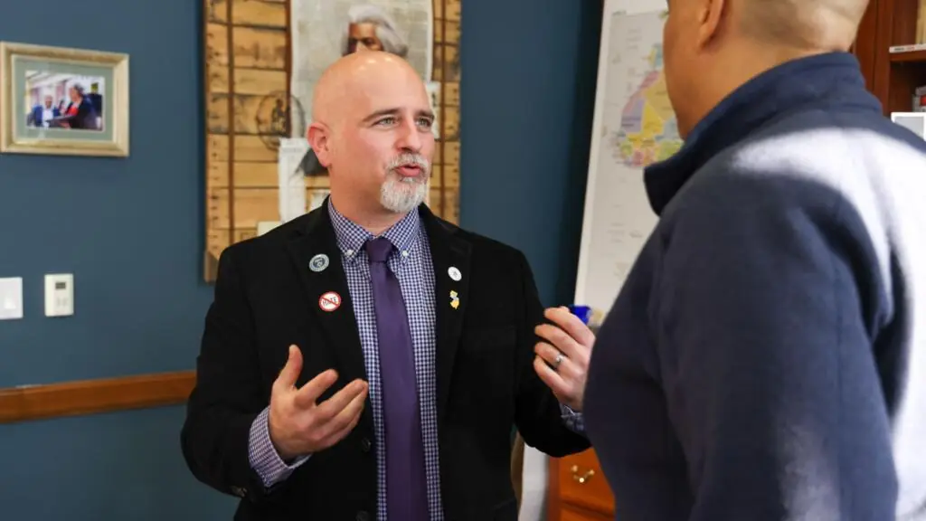 Joseph Nappi speaking with another man