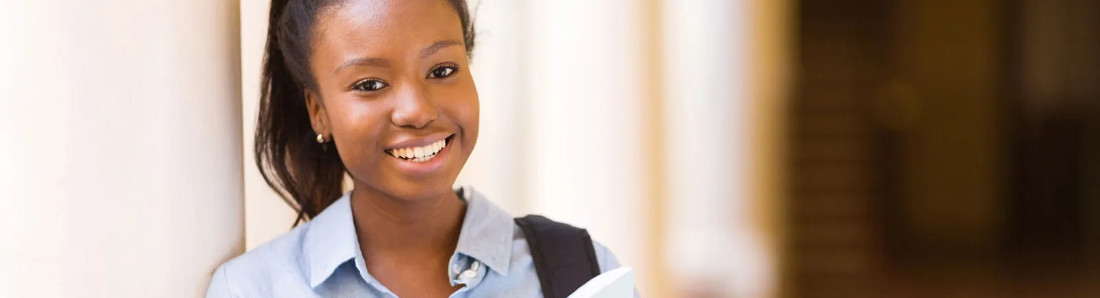 woman smiling in hallway