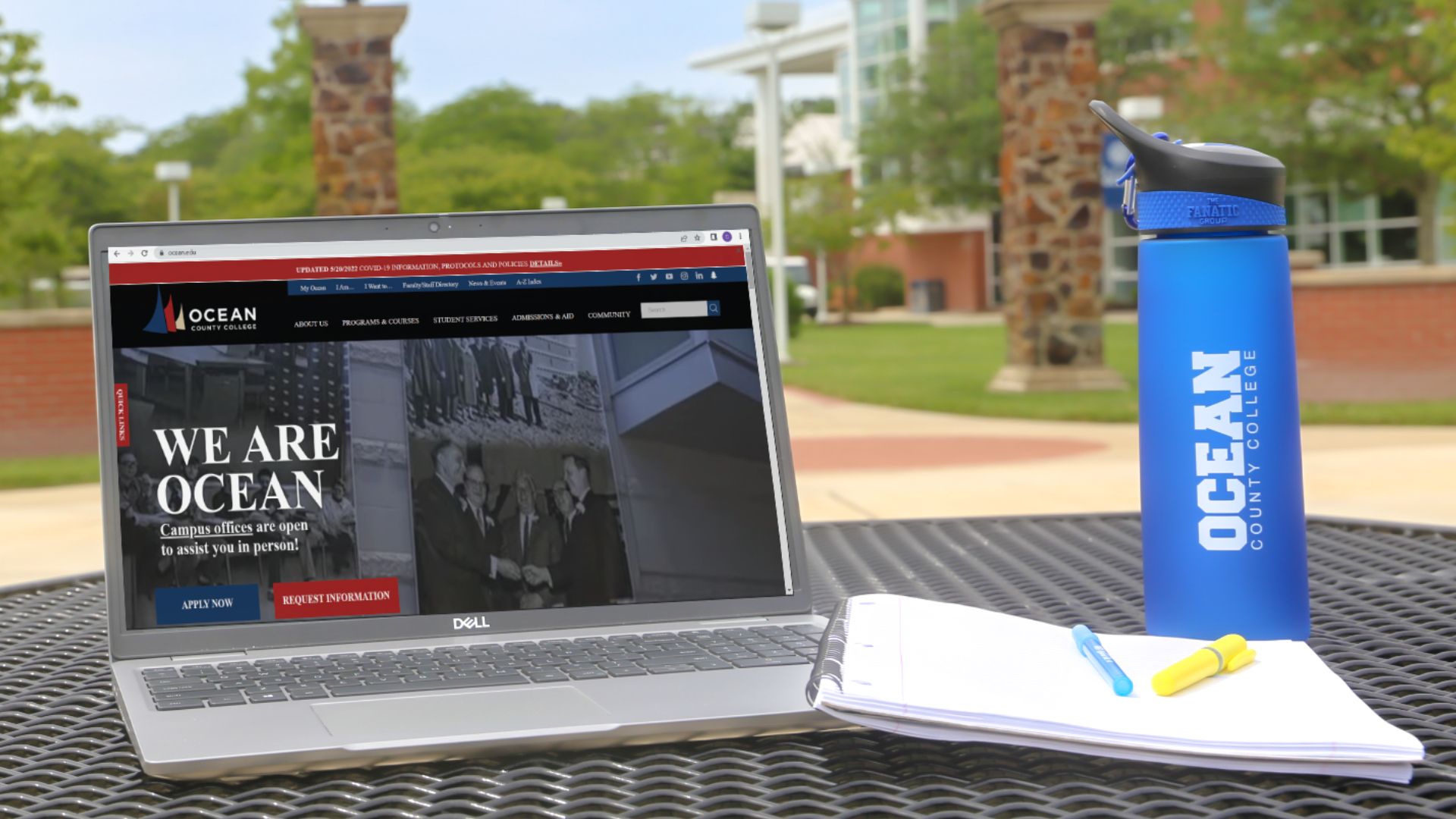 Laptop and water bottle placed outside looking at Ocean County College